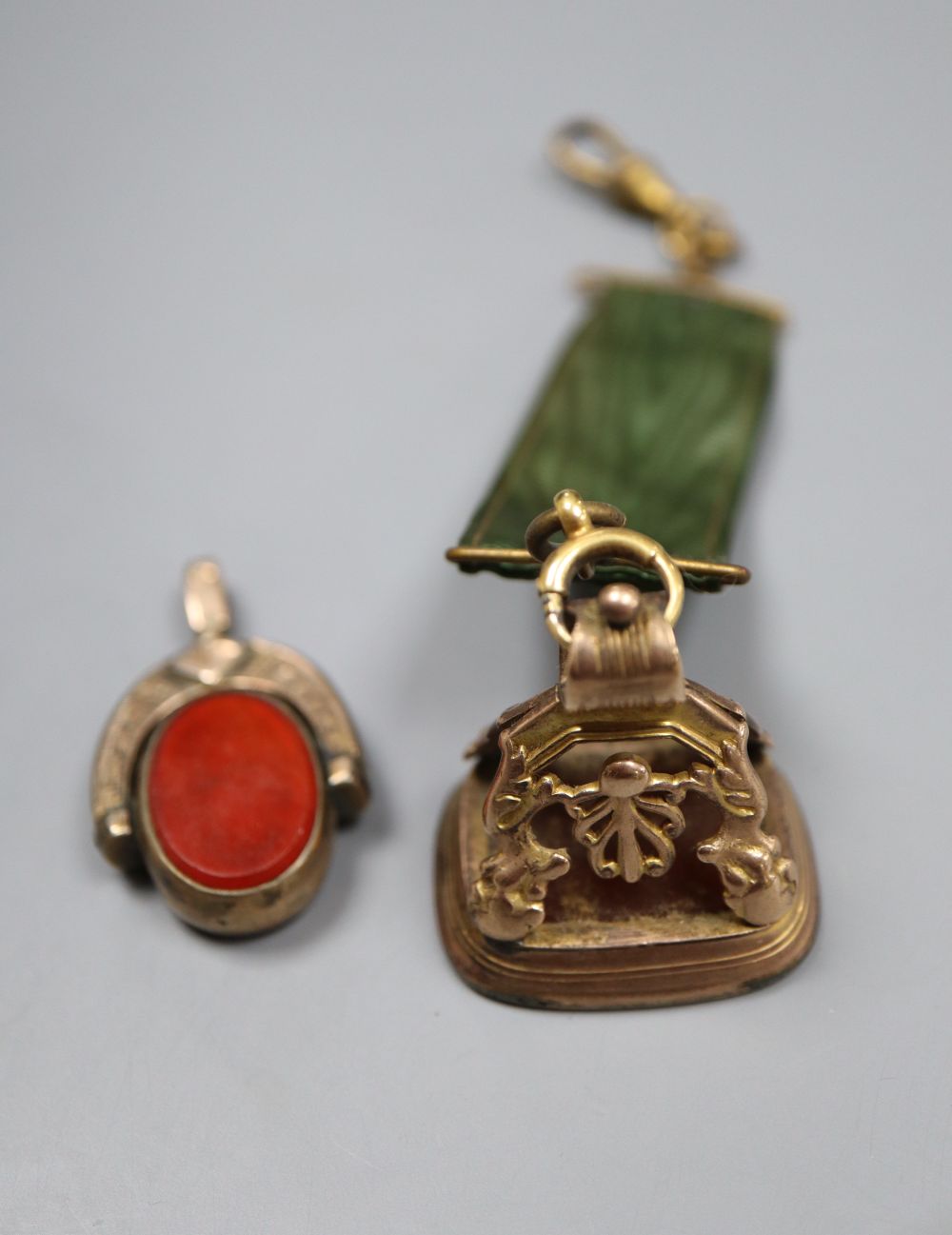 A Victorian yellow metal overlaid and cornelian seal and a swivel seal.
